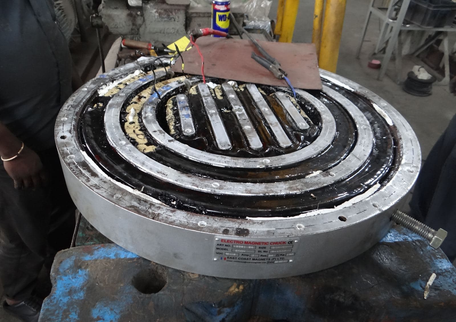 An electromagnetic chuck being prepared for rewinding